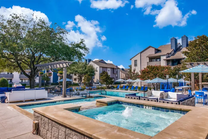 Expansive pool with sundeck and lounge chairs
