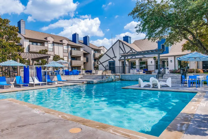 Expansive pool with sundeck and lounge chairs