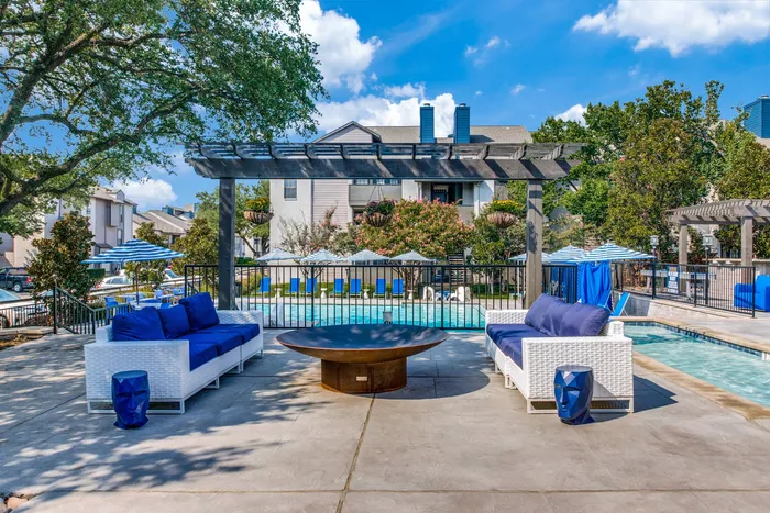 Poolside fire pit and lounge furniture