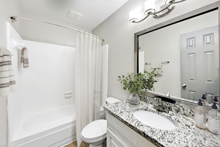 Virtual staging of bathroom with quartz style counter tops