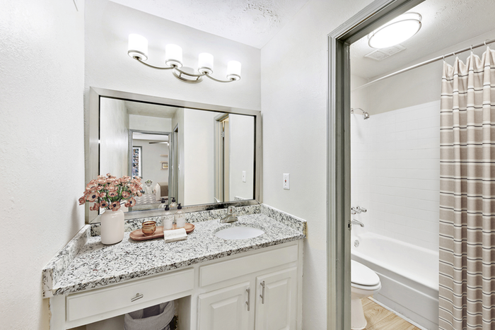 Virtual staging of bathroom with quartz style counter tops