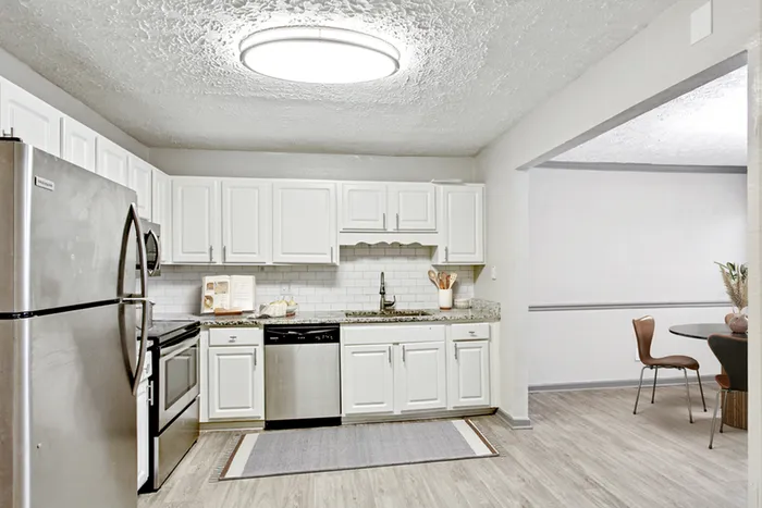 Virtual staging of kitchen and dining room with hardwood floors