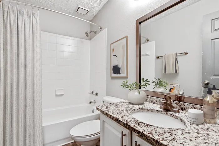 Virtual staging of bathroom with quartz style counter tops