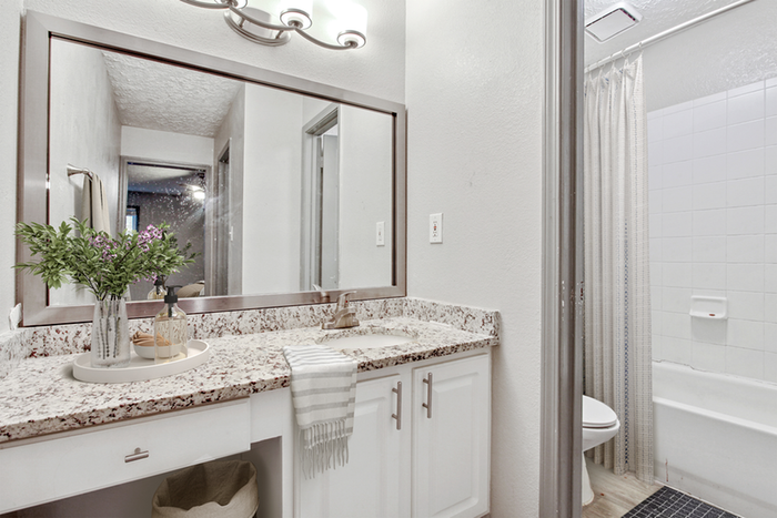 Virtual staging of bathroom with quartz style counter tops
