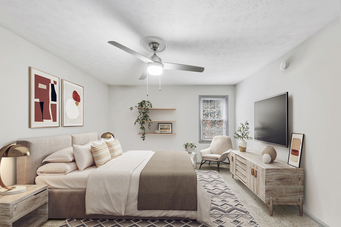 Virtual staging of bedroom with large bed and ceiling fan