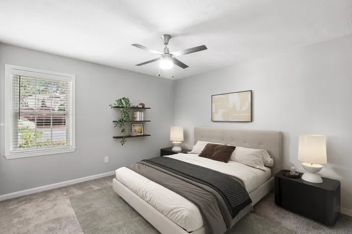 Virtual staging of bedroom with large bed and ceiling fan