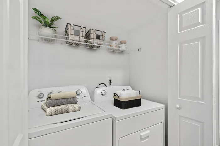 Utility room with washer and dryer