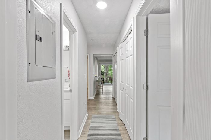 Virtual staging of hallway with hardwood floors