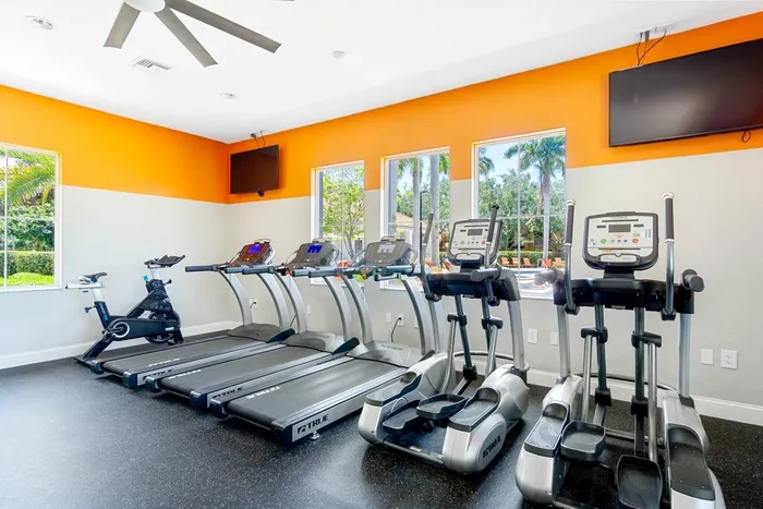 fitness center stationary bike, treadmills, ellipticals, flat screen TVs, and ceiling fan