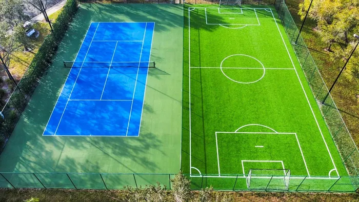 Exterior full size tennis court and full-size soccer field