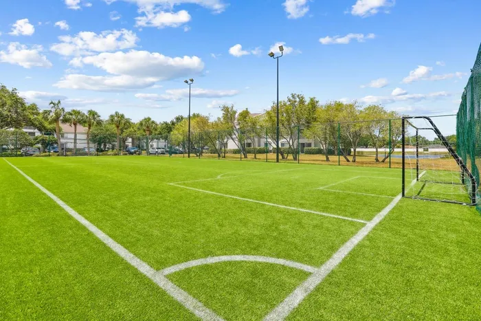 Soccer field with exterior lighting and native landscaping and shrubbery