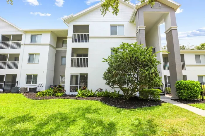 White three story exterior building with neat landscaping