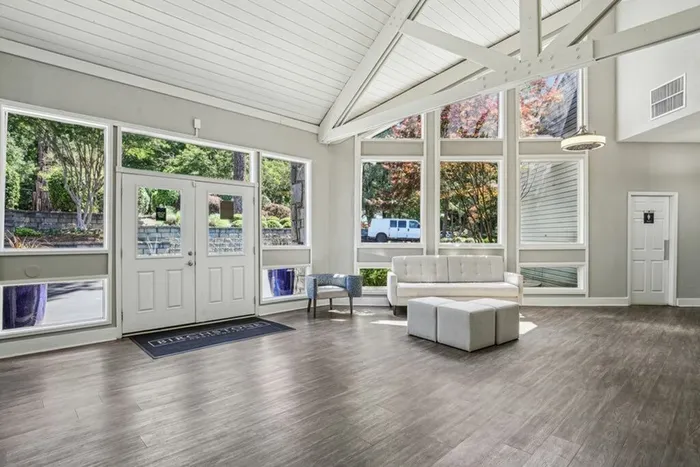 Leasing office with wood floors and couch