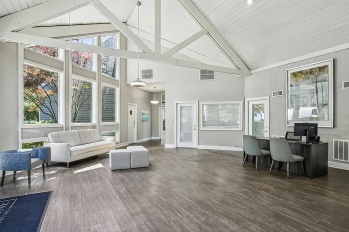 Leasing office with wood floors and couch