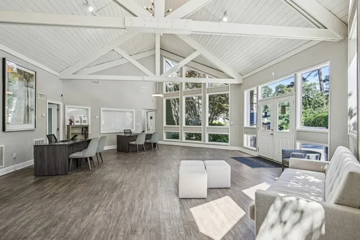 Leasing office with wood floors and couch