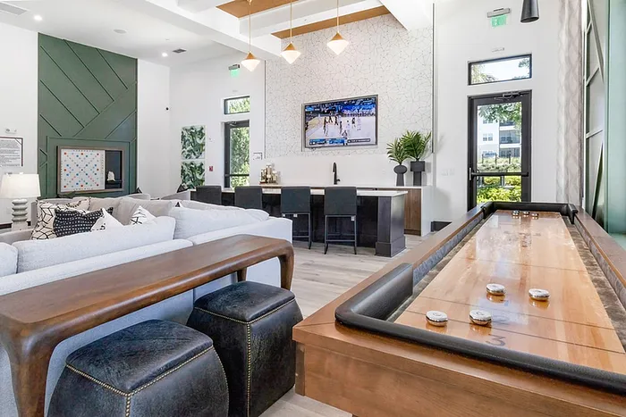 Clubroom with chairs and shuffleboard table