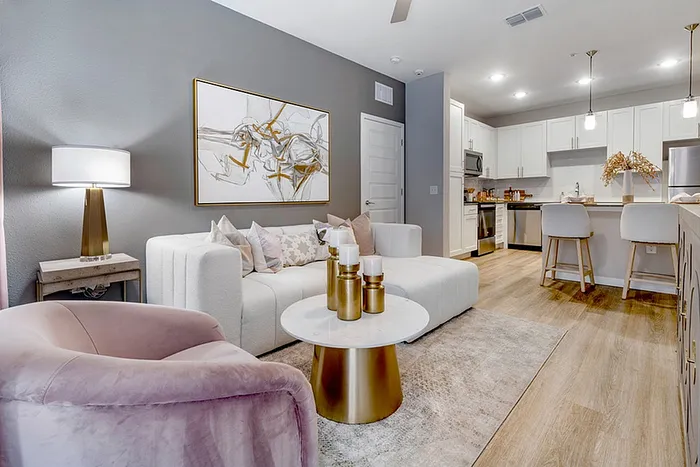 Renovated livingroom with wood style flooring and sofa