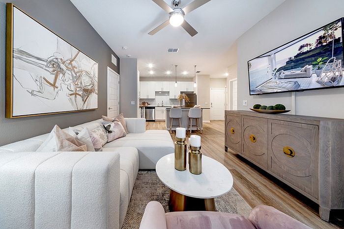 Renovated livingroom with wood style flooring and sofa