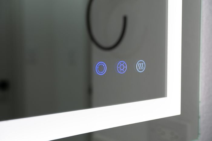 Bathroom vanity mirror with three buttons for lighting, dimmer and defog.