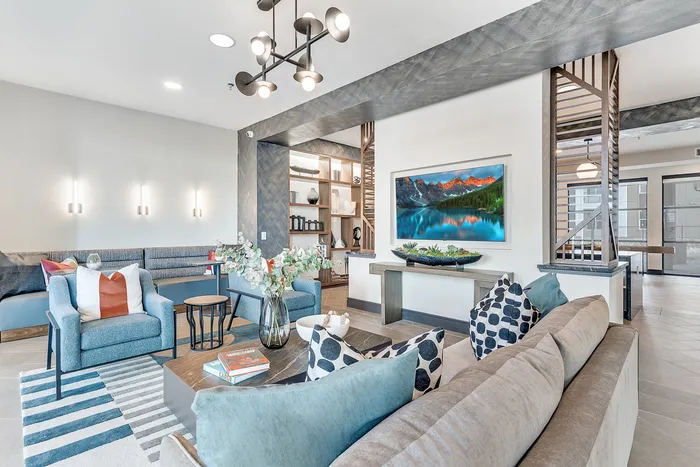 Inviting modern living room with chic furniture, elegant wall art, and ambient lighting, perfect for relaxation and entertaining.