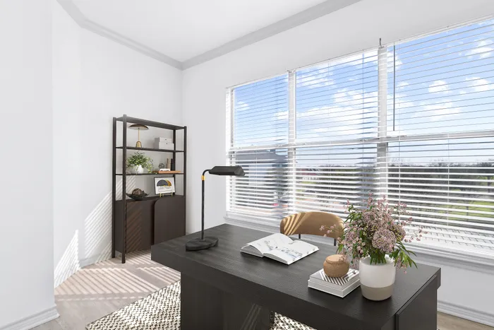 Bright and inviting home office with a large window view, modern desk, and elegant decor.