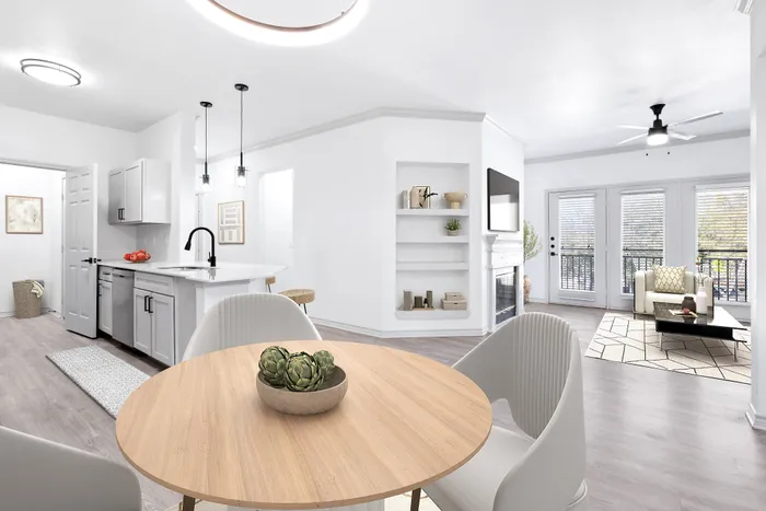 Bright and inviting open-concept living space with modern kitchen, cozy dining area, and elegant living room featuring floor-to-ceiling windows.