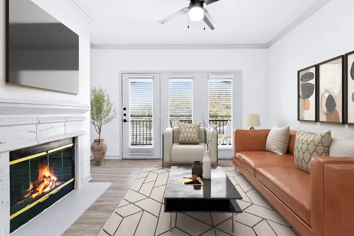 Chic living room with a cozy fireplace, stylish modern furniture, and floor-to-ceiling windows opening to a sunny balcony.