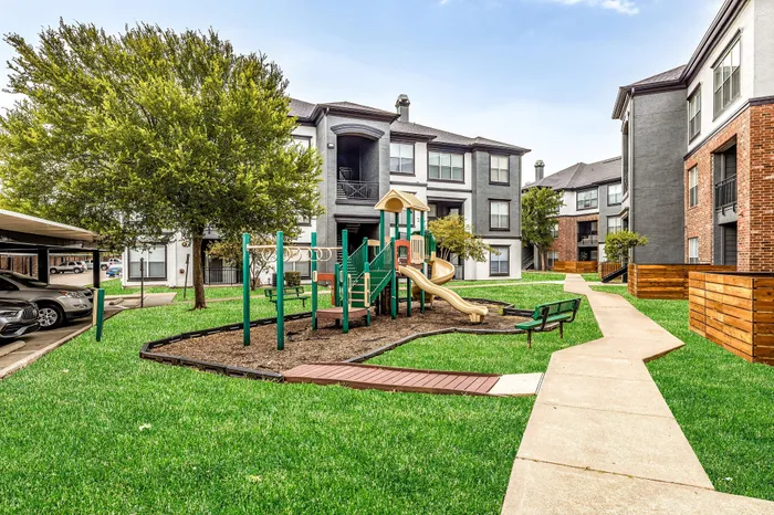 Community play ground, side walk and brick exterior community building
