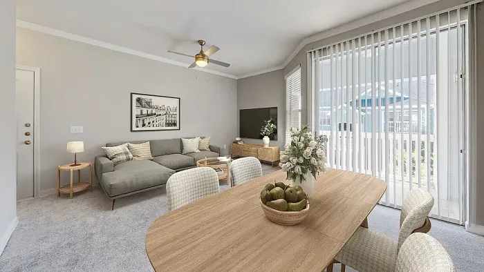 Bright open-concept apartment living and dining area with neutral carpeting, contemporary furnishings, a spacious dining table, large sliding glass doors, and abundant natural light throughout.