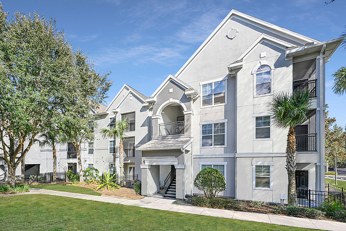 Charming apartment community with elegant architecture, lush landscaping, and abundant natural light.
