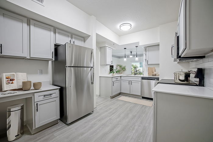 Contemporary kitchen with sleek stainless steel appliances, elegant cabinetry, and ample counter space.