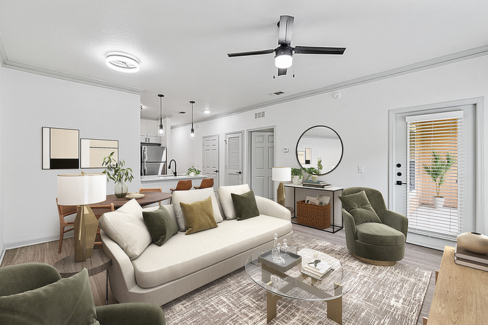 Elegant modern living room with cozy seating, open kitchen, and stylish decor, showcasing natural light through large windows.