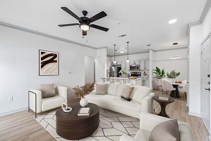 Elegant open-concept living area with stylish neutral furnishings, modern kitchen, and abundant natural light.