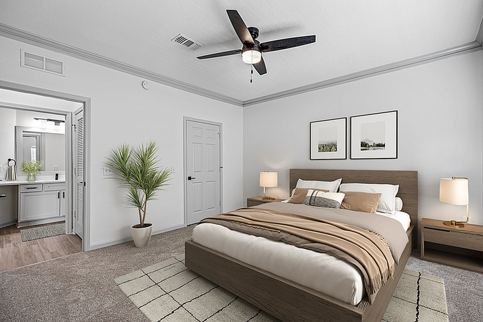 Elegant bedroom with cozy decor, featuring a plush bed, modern ceiling fan, and chic nightstands in a serene neutral palette.