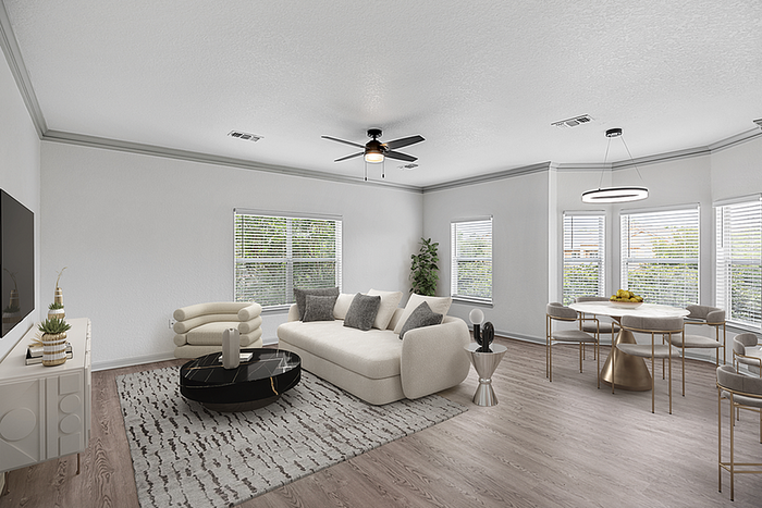 Contemporary open-concept living and dining room with elegant furnishings, large windows, and stylish lighting fixtures.