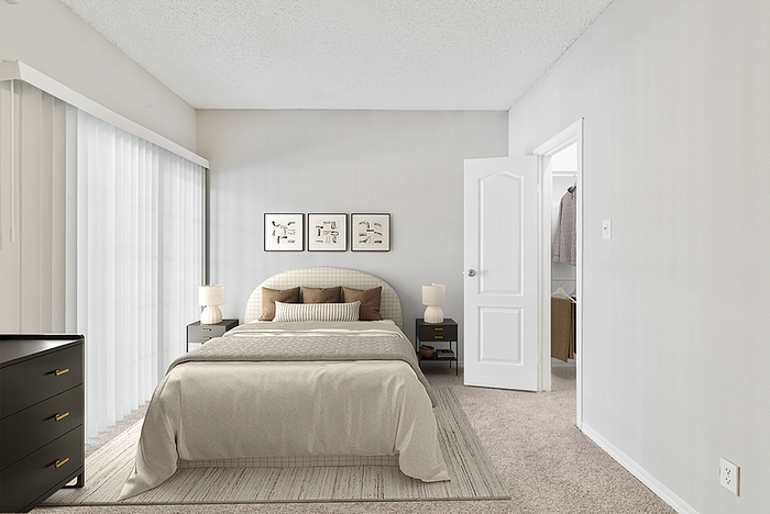 Inviting bedroom with a plush bed, modern decor, and natural light from large windows.