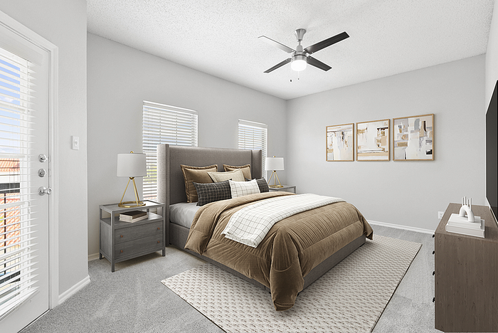 Bright, modern bedroom with sleek furniture, large windows, and stylish decor, offering a cozy and inviting atmosphere.
