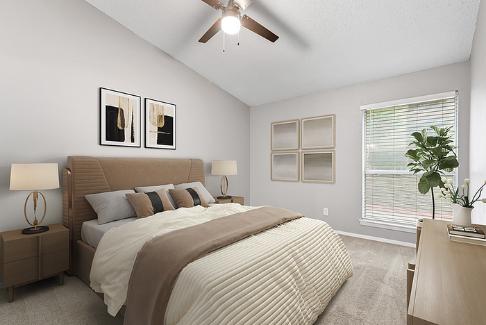 Elegant bedroom featuring a plush bed with neutral-colored linens, modern artwork, and abundant natural light from a large window. Perfect blend of comfort and style.