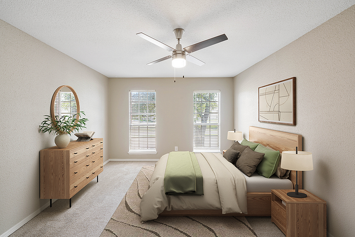 Elegant bedroom with modern wooden furniture, serene green accents, and large windows offering plenty of natural light.