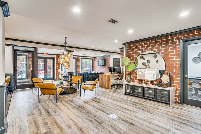 Chic apartment clubhouse with modern decor, featuring stylish seating, vibrant lighting, and a welcoming ambiance.