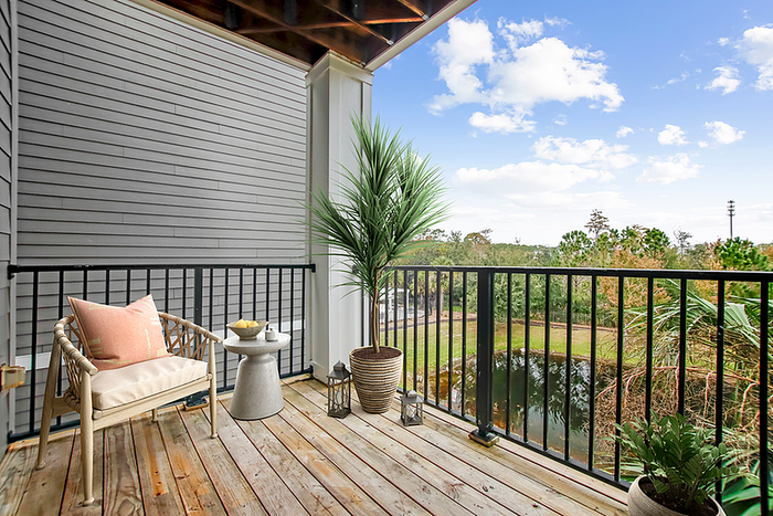 Charming balcony with cozy seating and lush views, perfect for relaxation and enjoying nature.