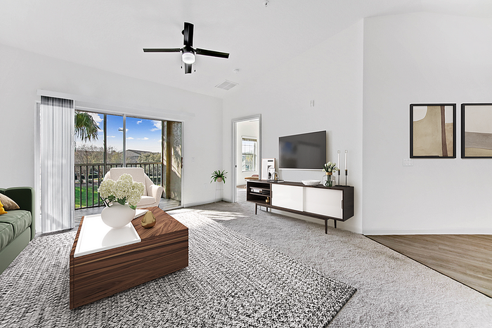 Bright and modern living room with elegant furnishings, large windows showcasing scenic views, and stylish decor.