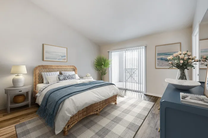 Newly renovated bedroom with natural lighting, a ceiling fan, and a generous closet.