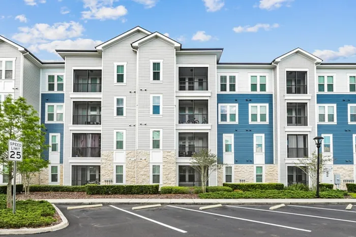 Blue, cream and grey exterior of Lantower Asturia Apartments