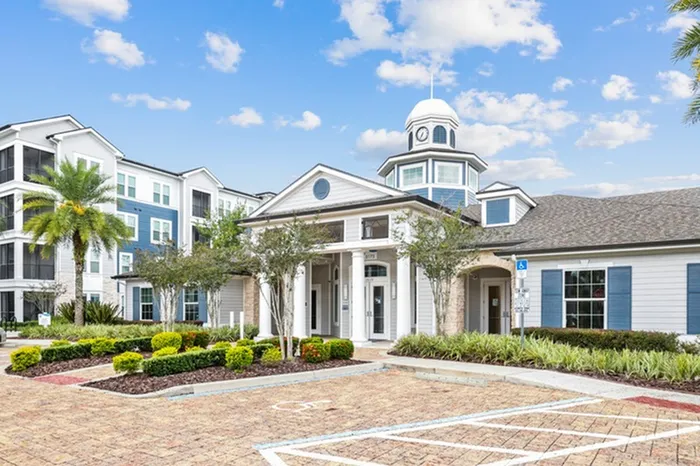 The colorful Welcome Center with blue accents and coastal design at Lantower Asturia.
