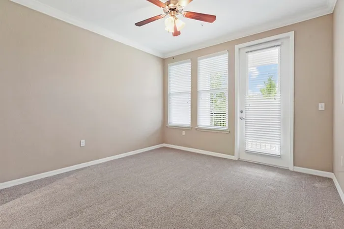 Living room with two large windows and a door leading to the balcony at Lantower Asturia.
