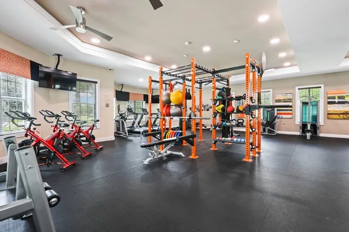 Fully Equipped Fitness Studio featuring Crossfit Box with large ceiling fans and large windows to let in natural light Resort-style pool with sundeck and lounge chairs at Lantower Asturia.