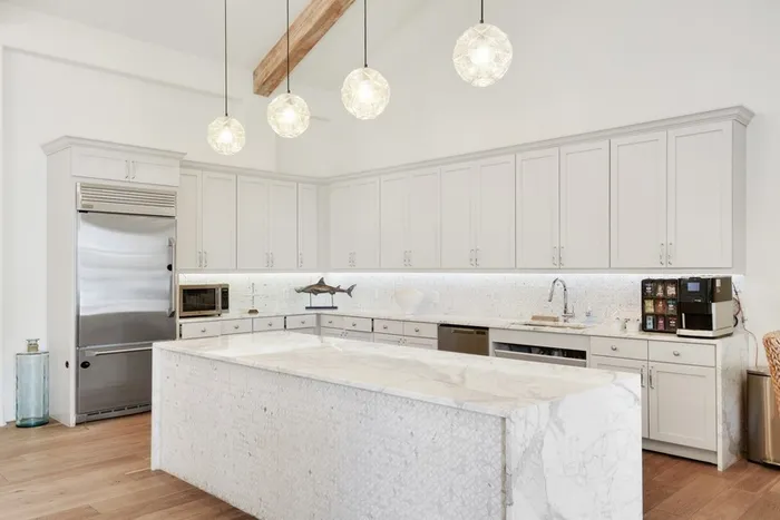 Apartment Kitchen with quartz countertops and stainless steel appliances at Lantower Edgewater