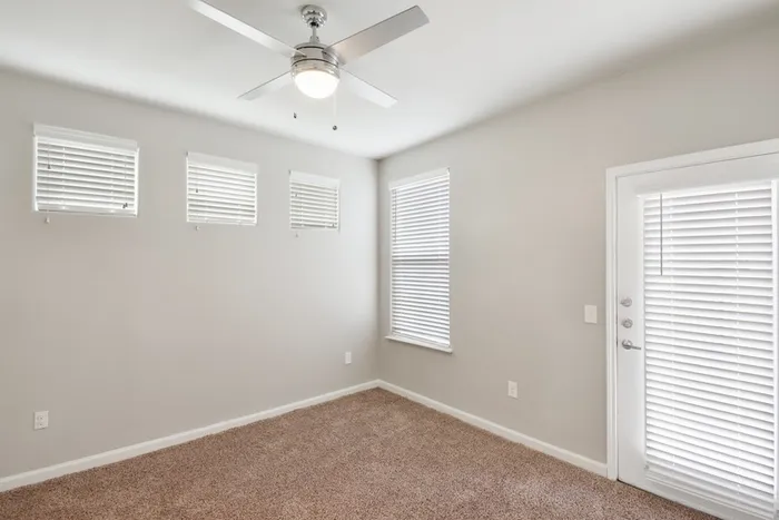 Bedroom with carpet flooring and natural lighting with windows at Lantower Edgewater