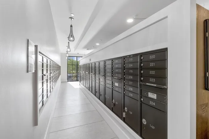 Spacious mailroom with floor-to-ceiling windows at Lantower Grande Flats Apartments.